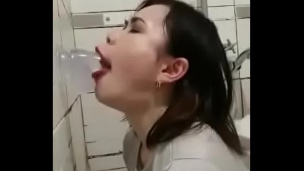 Asian deepthroating a dildo