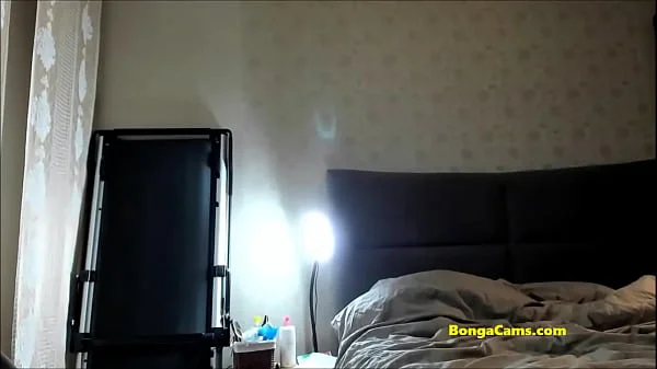 Milf with big boobs from BongaCams rides dildo on her bed